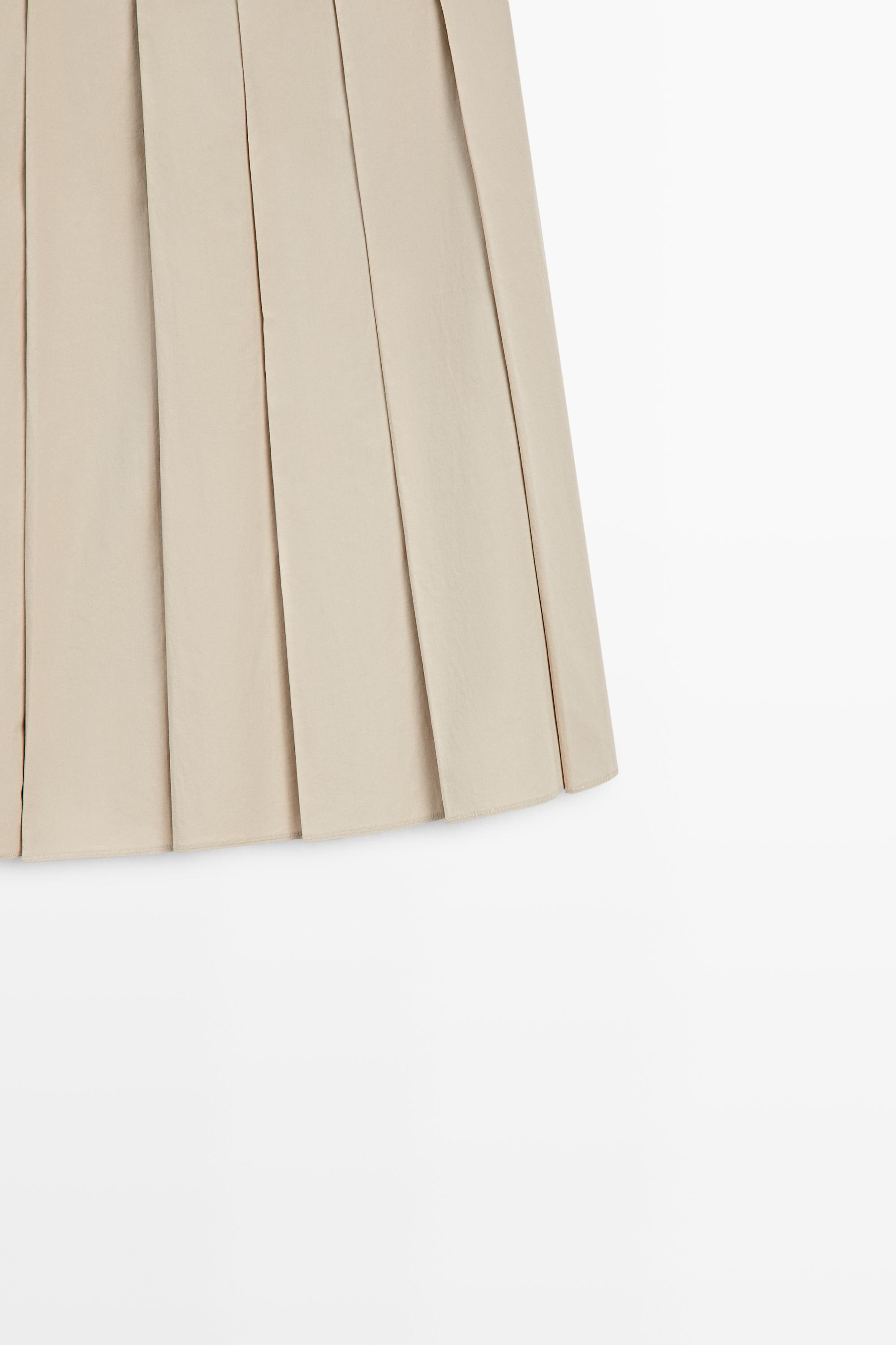Pleated midi skirt with contrasting sash